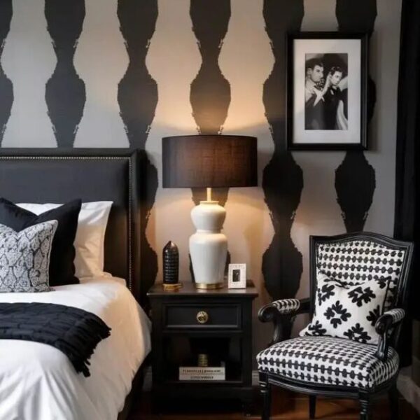 A stylish black and white bedroom featuring a… A stylish black and white bedroom featuring a…