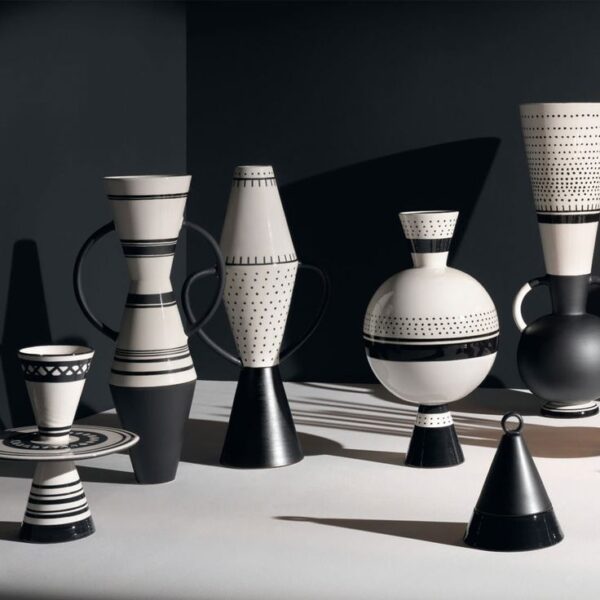 Conical and spheroidal vases play with lines and… Conical and spheroidal vases play with lines and…